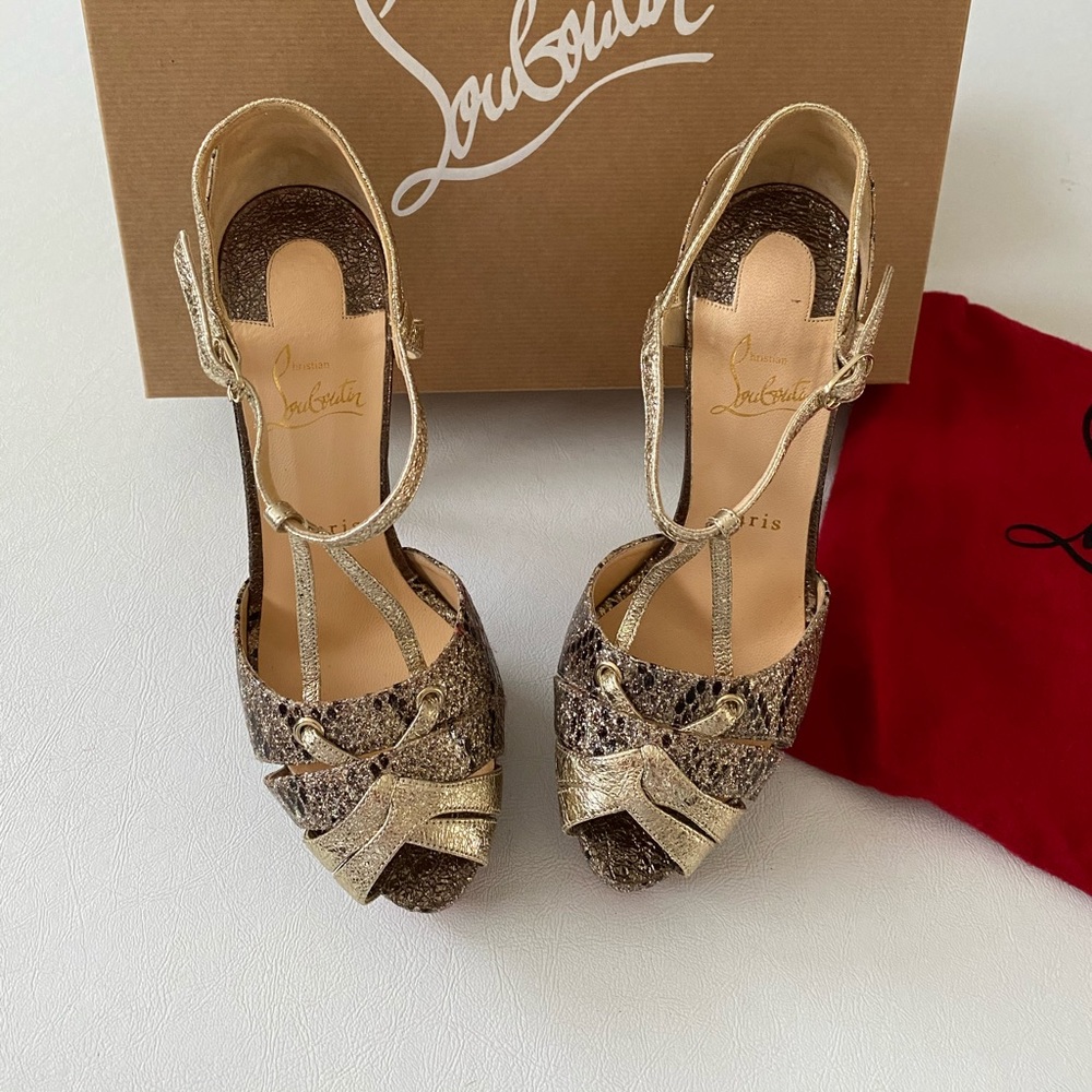 Louboutin 150 mm Glitter T-Strap heels.